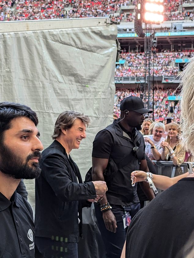 Tom Cruise is one of the thousands of attendees at Taylor Swift's concert in London