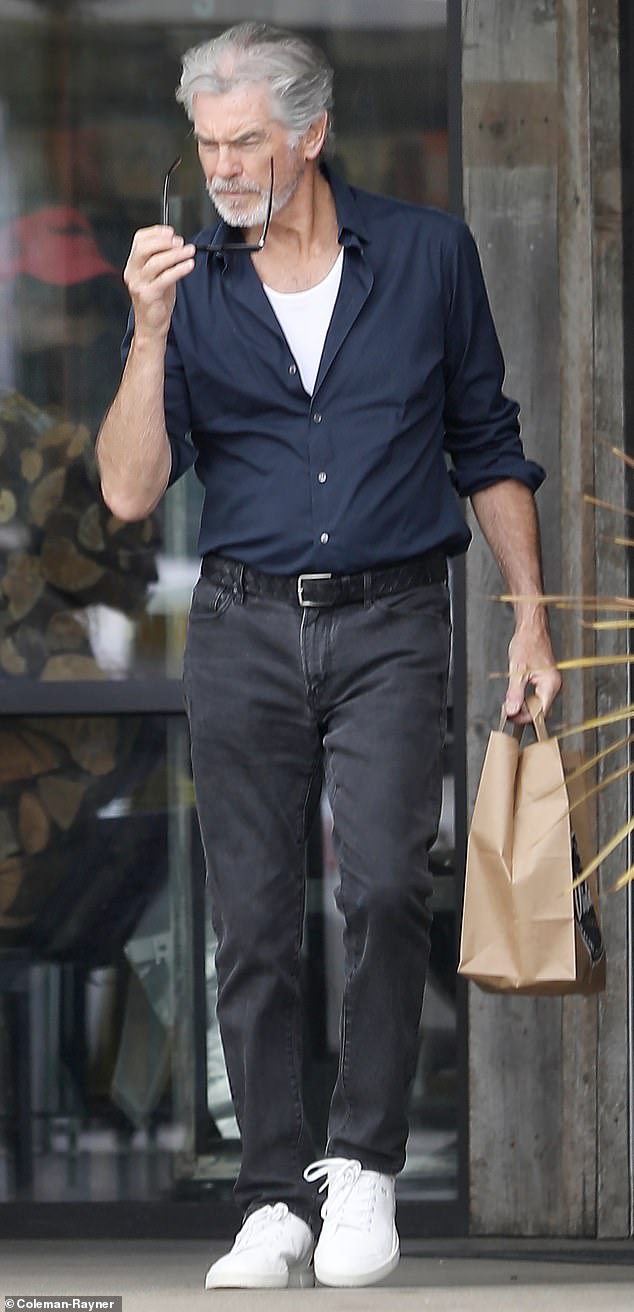 Brosnan wore black jeans with white sneakers and wore designer sunglasses to block out the California sun as he left the supermarket