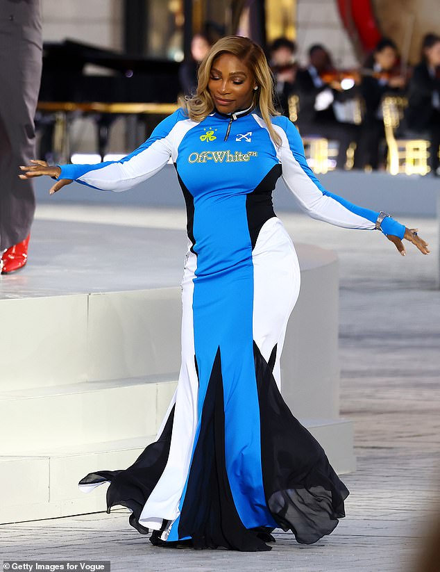 Meanwhile, Serena showed off her amazing figure in a blue, black and white Off White dress that resembled a long-sleeved sports top with a quarter zip before flowing into a fishtail skirt