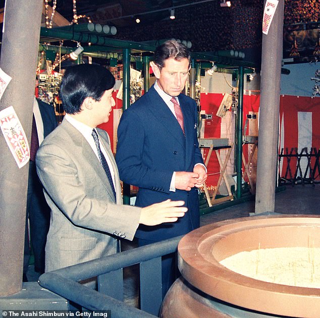 Japan's then Crown Prince Naruhito and Prince Charles view an exhibition after the opening ceremony of the 1991 Japan Festival at the Victoria & Albert Museum