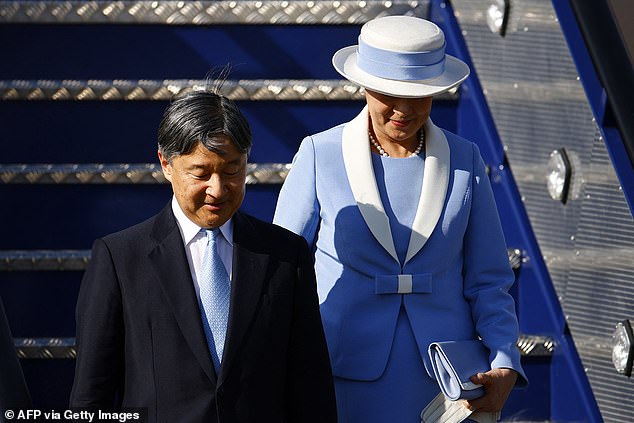 Empress Masako, 60, looked elegant in a powder blue suit with white lapels and a matching hat