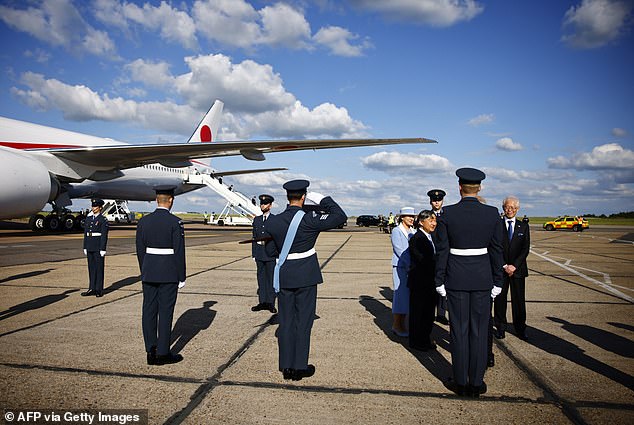 Members of the RAF saluted the couple as they made their way to a service vehicle