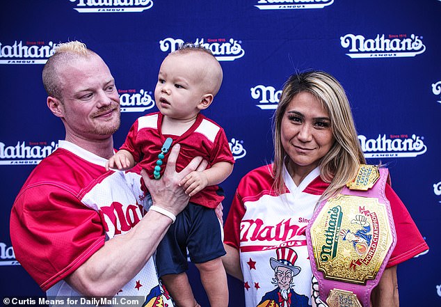 Sudo is married to Nick Wehry, the world's fourth-ranked eater, who she says she practices with when they're not caring for their toddler Max (pictured together after her 2022 win)