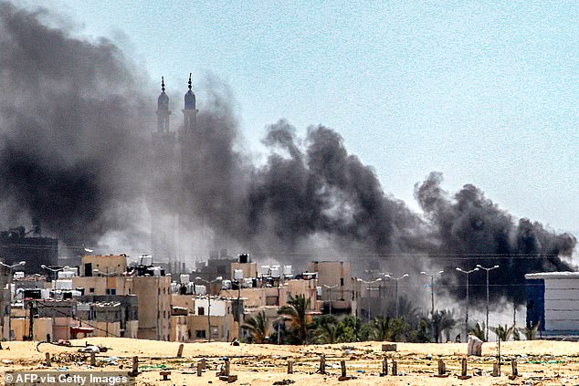 Plumes of smoke rise during ongoing fighting in the Sultan neighborhood of northwestern Rafah in the southern Gaza Strip on June 18, 2024