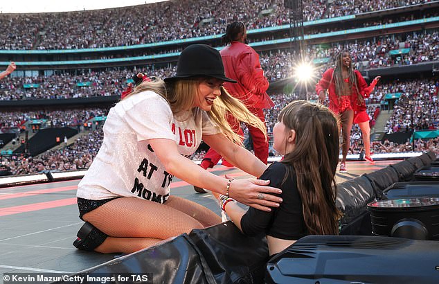 Swift was spotted chatting to a young girl in the audience as she performed the Red Era of her show at Wembley Stadium on Saturday