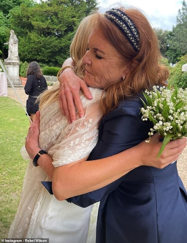 Pictured: The Duchess of York was seen cuddling bride Marissa Montgomery at her wedding at Chelsea Physic Garden this weekend