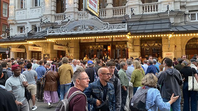 Audiences gather outside the Noel Coward theater after being forced to evacuate