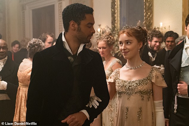 Meanwhile, Bridgerton star Phoebe, 29, had to perform several sex scenes in the steamy Netflix period drama opposite her co-star and heartthrob, Rege-Jean Page (pictured together in the show)