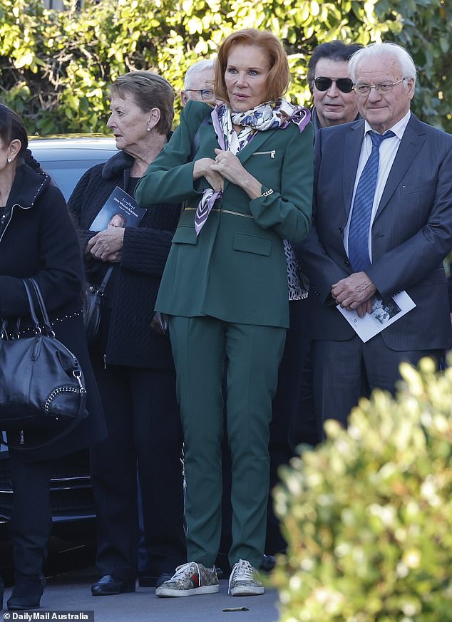 Rhonda Burchmore (right) was also in attendance, wearing a green suit