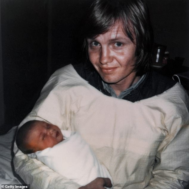 Jolie's parents Voight and Bertrand tied the knot in 1971 and welcomed their second child - Angelina Jolie Voight - in 1975. The photo shows Voight with Jolie, hours after she was born.