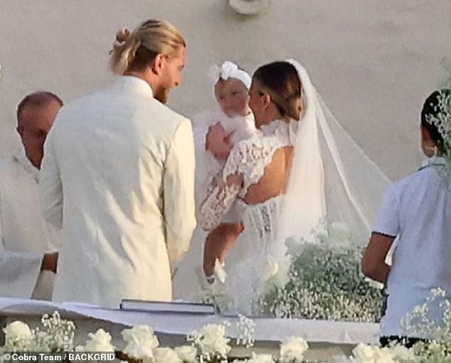 The couple exchanged vows in front of the breathtaking view of the Tyrrhenian Sea, together with their daughter Aria, who turns one in August