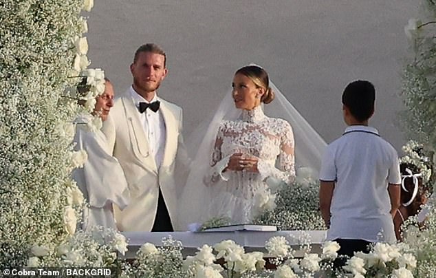 Meanwhile, Loris, who got married on the day of his 31st birthday, opted for a tuxedo with a white jacket, while his blonde hair was also tied back from his face.