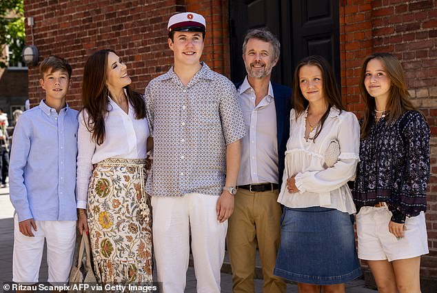 Mary looked lovingly at her son as the family smiled for photos.  Pictured L-R: Prince Vincent, Queen Mary, Prince Christian, King Frederik, Princess Isabella and Princess Josephine