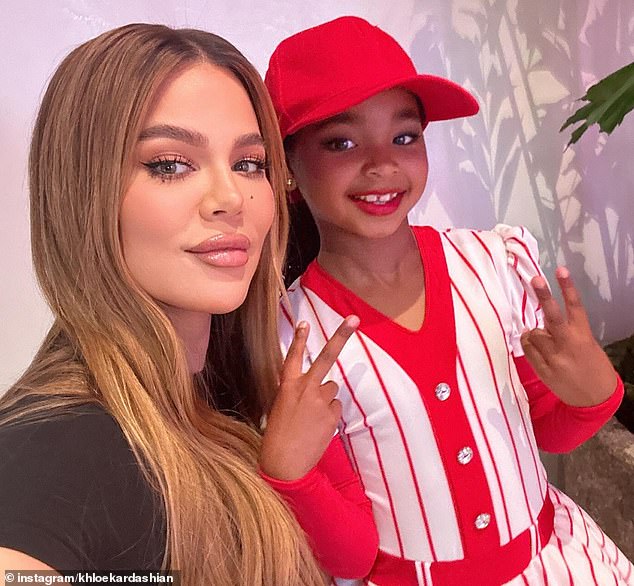 She, the child, whose father is Khloe's ex-boyfriend Tristan Thompson, wore a red suit and cap