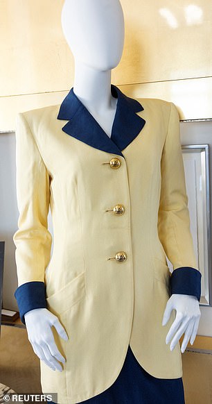One of the Princess's favorite designers, Catherine Walker, created her two-piece yellow and navy blue skirt suit that she wore several times during a visit to Hong Kong in 1989 for the opening of the Red Cross.