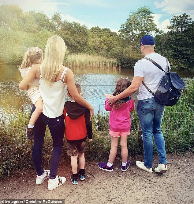 Christine shares twins Penelope and Leo, 10, and Felicity, 7, with Paddy, 50, and all still live together (pictured in 2021)