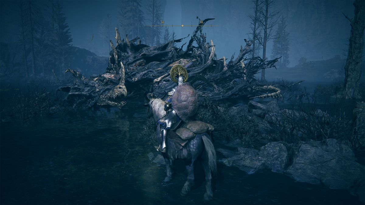 An Elden Ring DLC ​​player walks up to a Ghostflame Dragon at night.