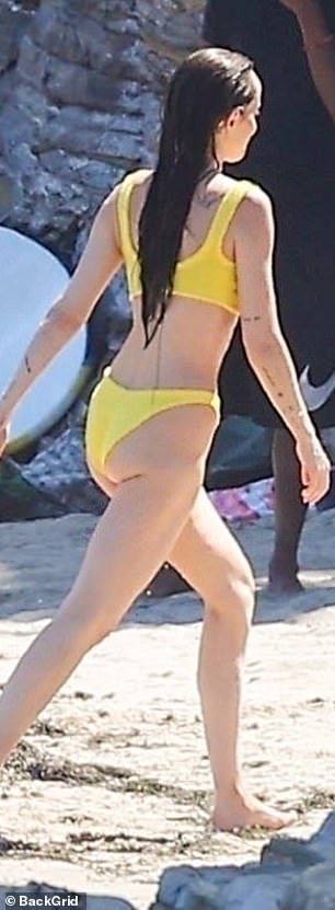 Johnson, Ezer and Dolores' godmother, gave a breathtaking performance as she walked through the sand in a fun yellow bikini