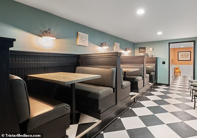 The dining area is reminiscent of a vintage diner, complete with black and white checkerboard floors
