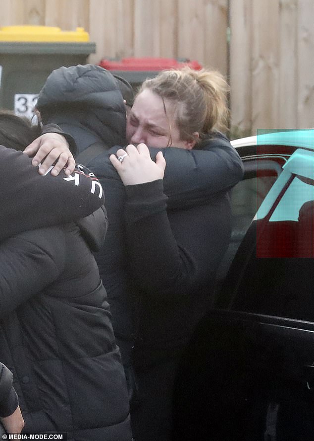 Another family member could be seen hugging Mrs Lewis as she collapsed at the scene
