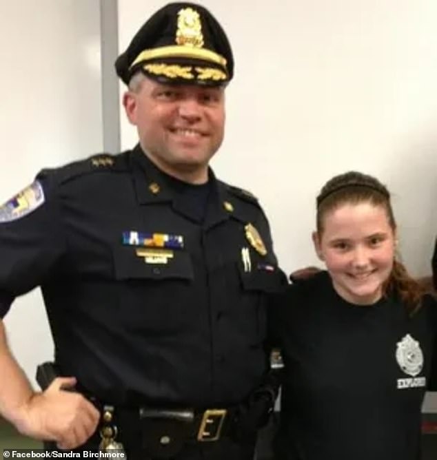 Sandra Birchmore joined the Stoughton Police Department's Explorer's Program at the age of 13.  She is pictured with former agent Robert Devine