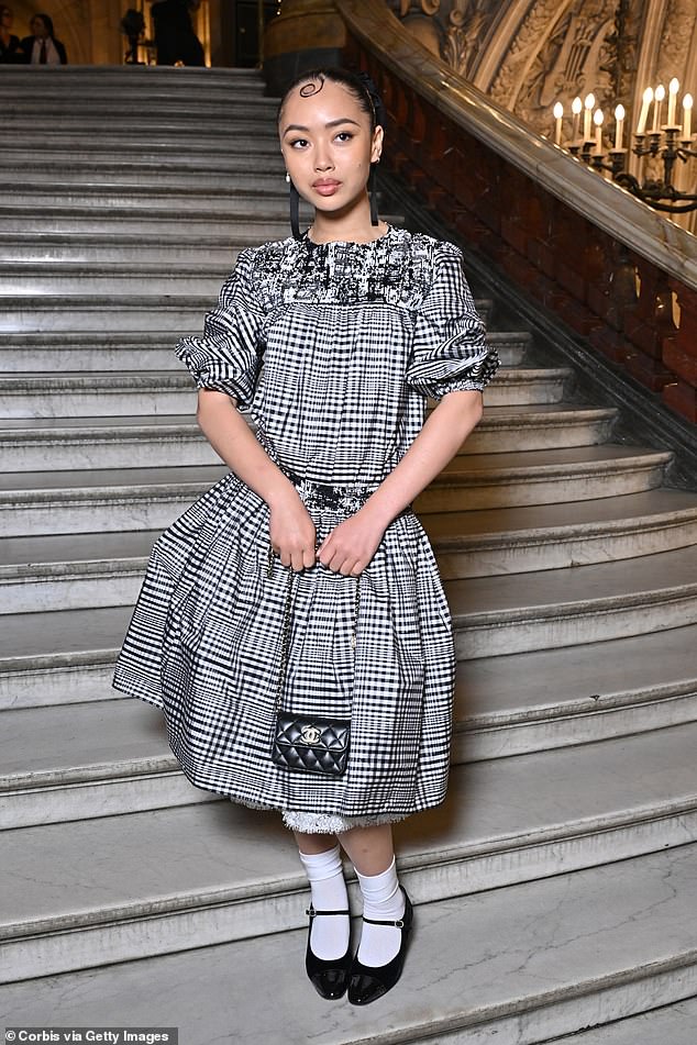 Griff opted for a quirky black and white checked dress with puffed sleeves and laced hem