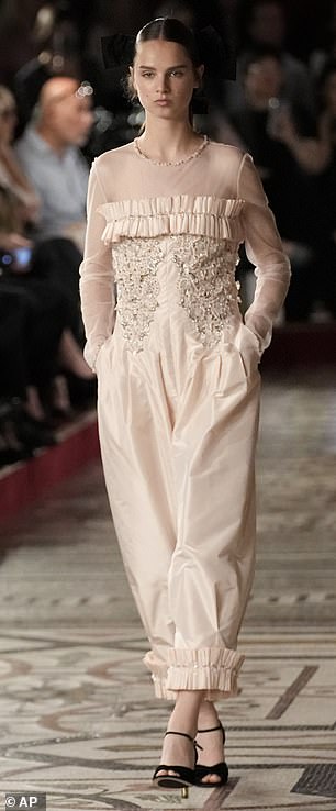 One wore a pale pink satin dress adorned with an embellished bodice