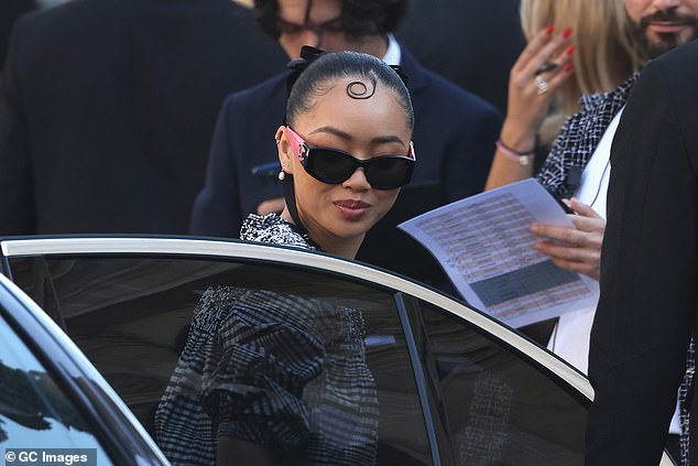 Griff arrived wearing Chanel sunglasses with pink temples, while her hair was scraped back into a tight bun, secured with a black bow