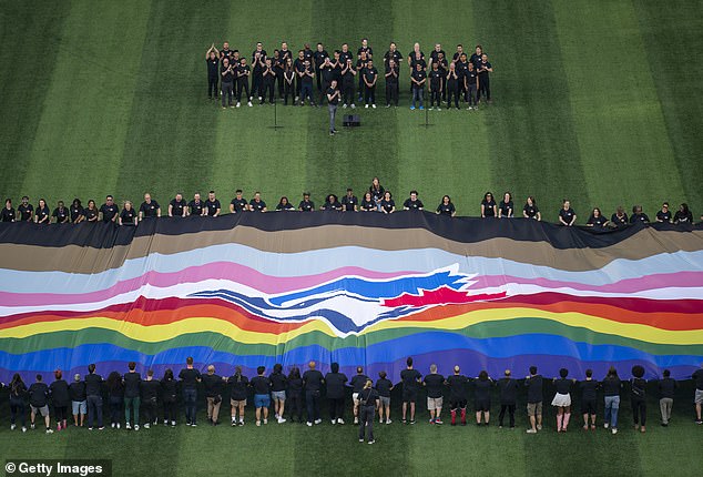 During Pride Night, a Pride-themed flag is displayed before the Blue Jays vs.  the Guardians