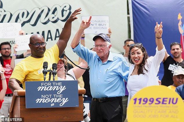 Bowman (left) greets Sen. Bernie Sanders, I-VT, (center) and Rep. Alexandria Ocasio-Cortes (right) as they campaign in the Bronx borough of New York City on Sunday.