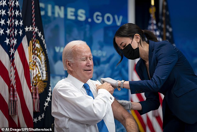 President Joe Biden cringes as he gets a COVID booster shot in October 2022