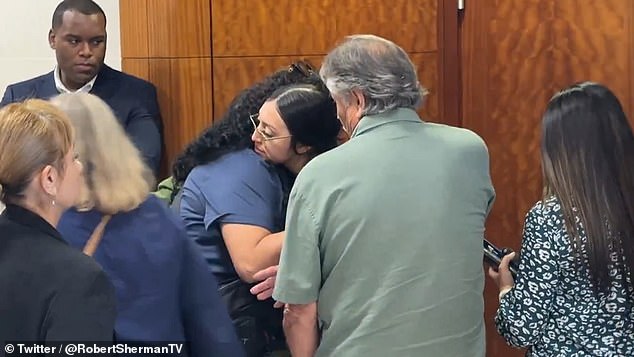 Jocelyn's mother Alexis hugs family members in the Harris Count courtroom