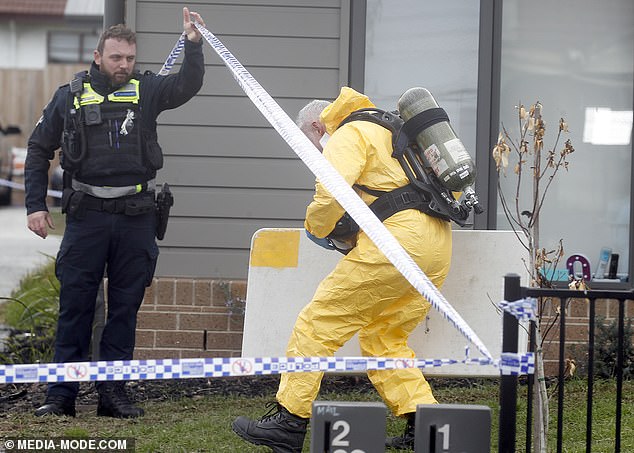 Officers wore hazmat suits and oxygen tanks when they entered the building on Tuesday