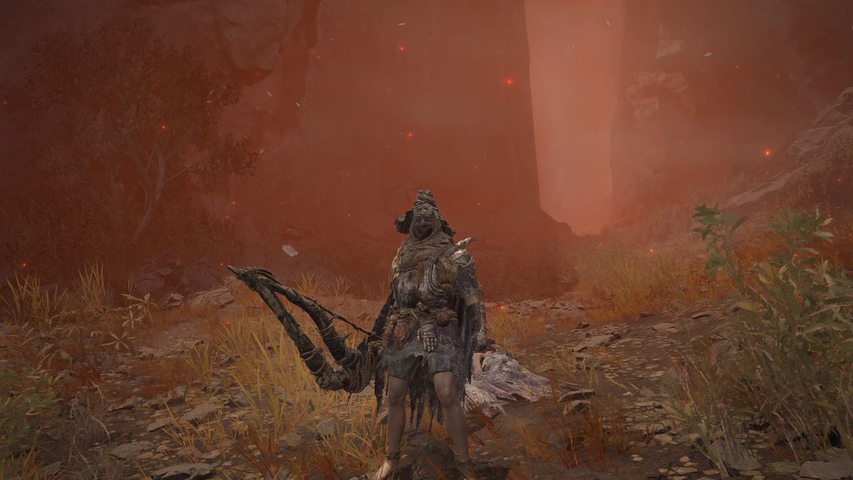 A corroded warrior wielding Igon's great bow and armor stands next to Igon's corpse in a screenshot from Elden Ring: Shadow of the Erdtree