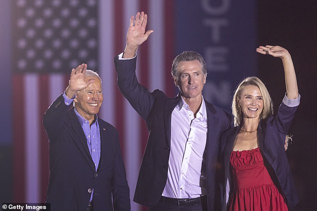 U.S. President Joe Biden, California Governor Gavin Newsom and Jennifer Lynn Siebel Newsom wave to a crowd on September 13, 2021 in Long Beach, California