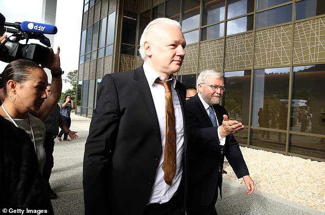 Assange and Rudd are seen walking into the US court in the Northern Mariana Islands in the Pacific Ocean