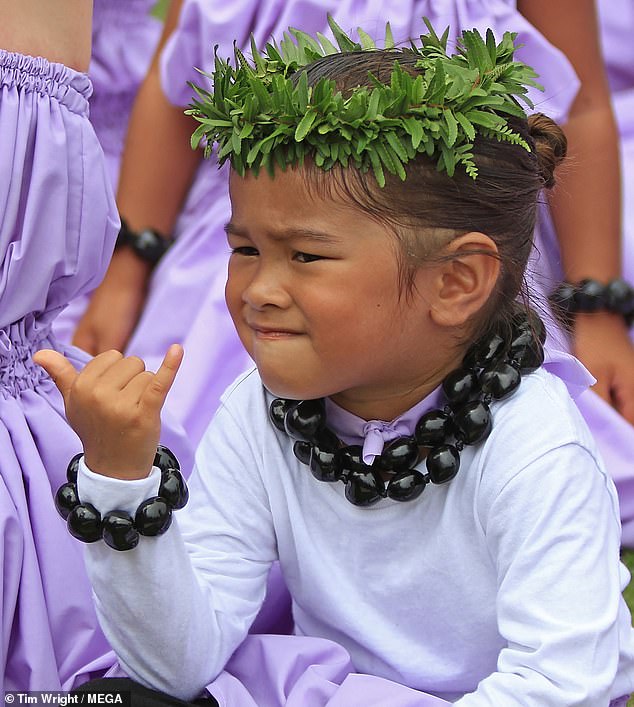 The symbol has long been known to connect people around the world to their strong island roots.  It is also displayed as a symbol of connection and community.  (photo: a child holding a shaka)
