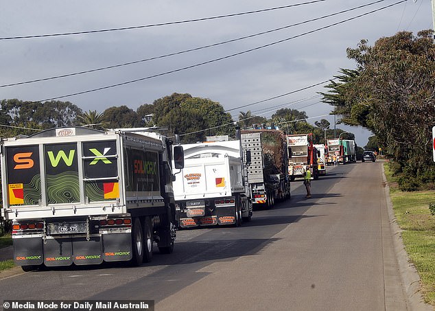 Trucks seen along Justice Road to The Block last month