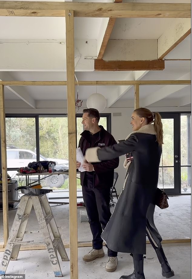 The former model described the new design for the property as 'country ranch' and revealed plans for a lavish kitchen.  Pictured: Bec inspecting the structure