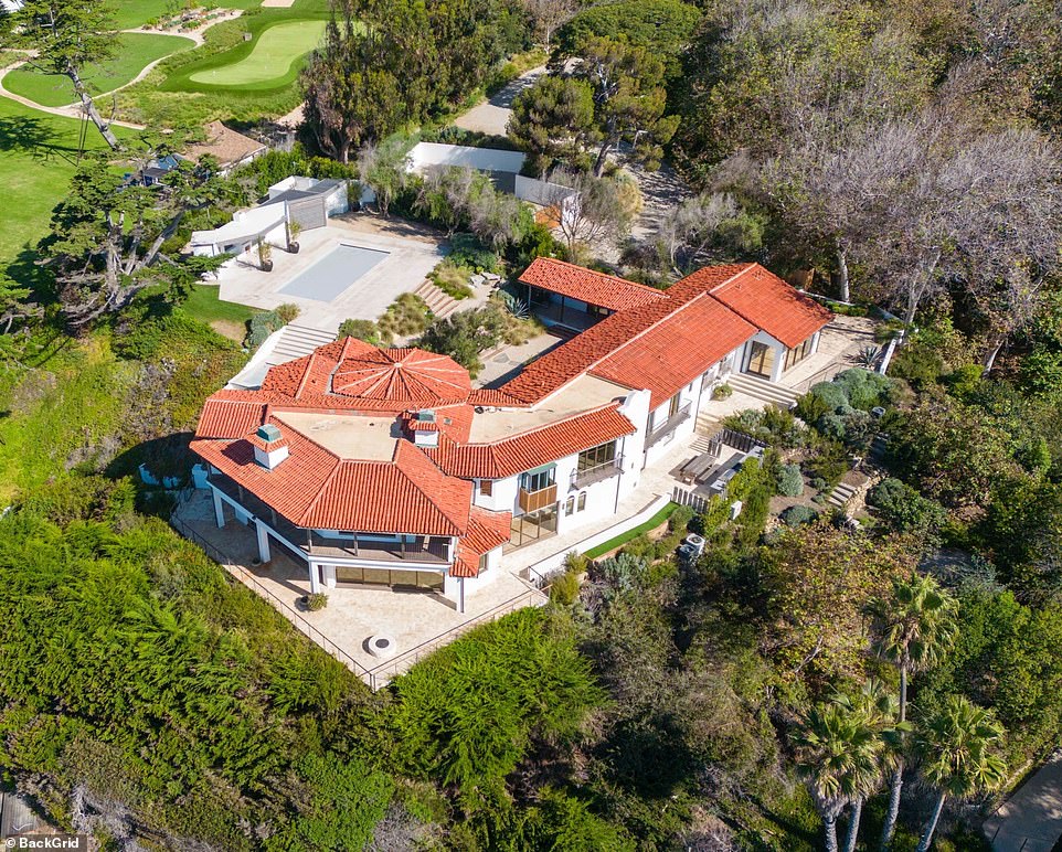 BEFORE: The breathtaking mansion previously had a Mediterranean-inspired look, which she changed for a contemporary, monochromatic design to complement her $60 million mega-mansion in Hidden Hills