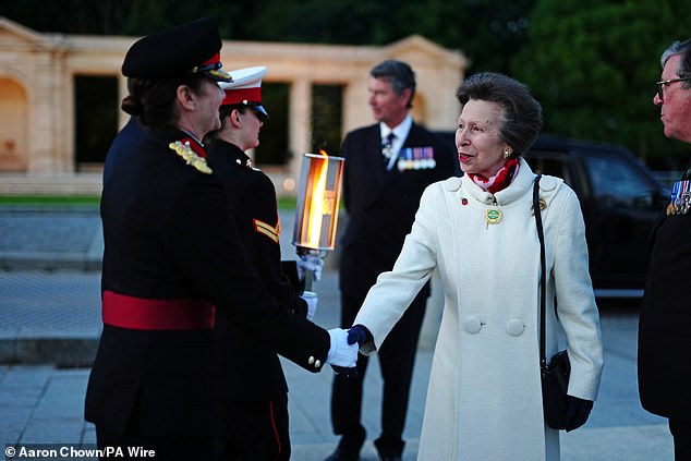 The Princess Royal shakes hands with Brigadier General Anna Kimber, program director for D-Day 80, at the Bayeux War Cemetery in Normandy, France, on June 5