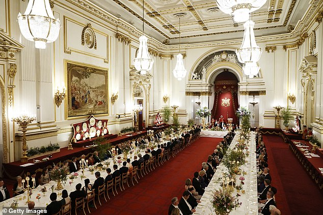 Guests sit during the state banquet at Buckingham Palace in London yesterday