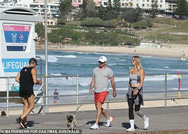 Further north in Brisbane, conditions will be much warmer with highs of 24°C on Wednesday, 22°C on Thursday and 23°C on Friday (pictured, people enjoying the sunshine in Sydney)