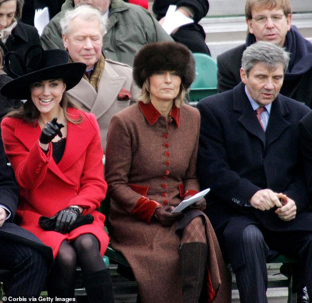 In December 2006, Kate joined Queen Elizabeth II, Prince Philip and then-Prince Charles at William's passing out parade in Sandhurst.  It was her first official appearance alongside the royal family.  Above: Kate sits next to her mother Carole and father's friends Michael and William