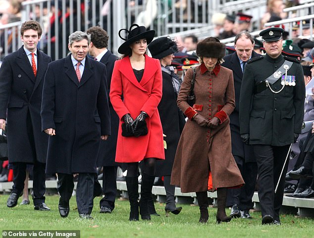 Kate walks between her mother and father during William's passing out parade at Sandringham in December 2006