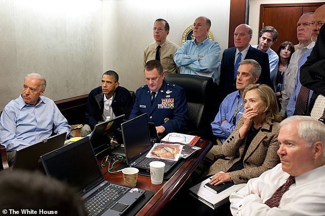 Clapper was seen standing on the far right next to former President Barack Obama and current President Joe Biden and Secretary of State Hillary Clinton as they watch a video of the mission to capture Osama Bin Laden in 2011