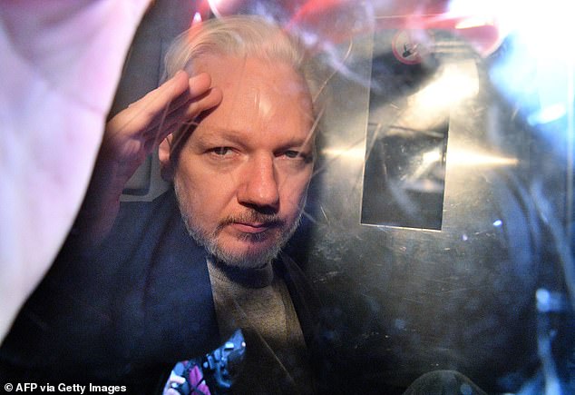 Assange has been held in one of Britain's most secure prisons since April 2019.  He is pictured here in May 2019