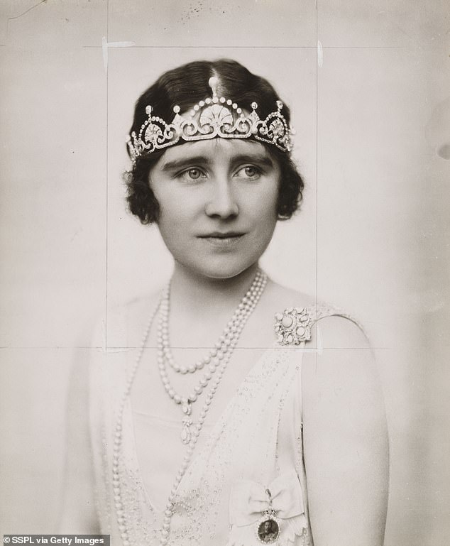 The delicate diamond tiara features fan motifs topped by floating diamond arches and is also known as the Papyrus Tiara;  it was made by British jeweler Garrard from one of the necklaces of Duchess Elizabeth of York herself.  Pictured in 1923