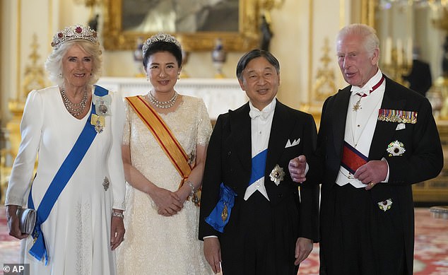 The King and Queen posed in full regalia for a state banquet with the Emperor and Empress of Japan