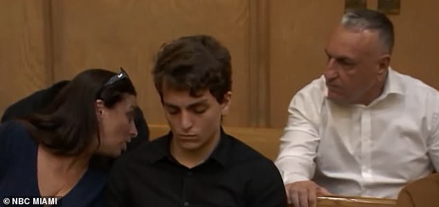 He is seen in court with his parents.  His father is Eli Gil, who works for the Israeli embassy